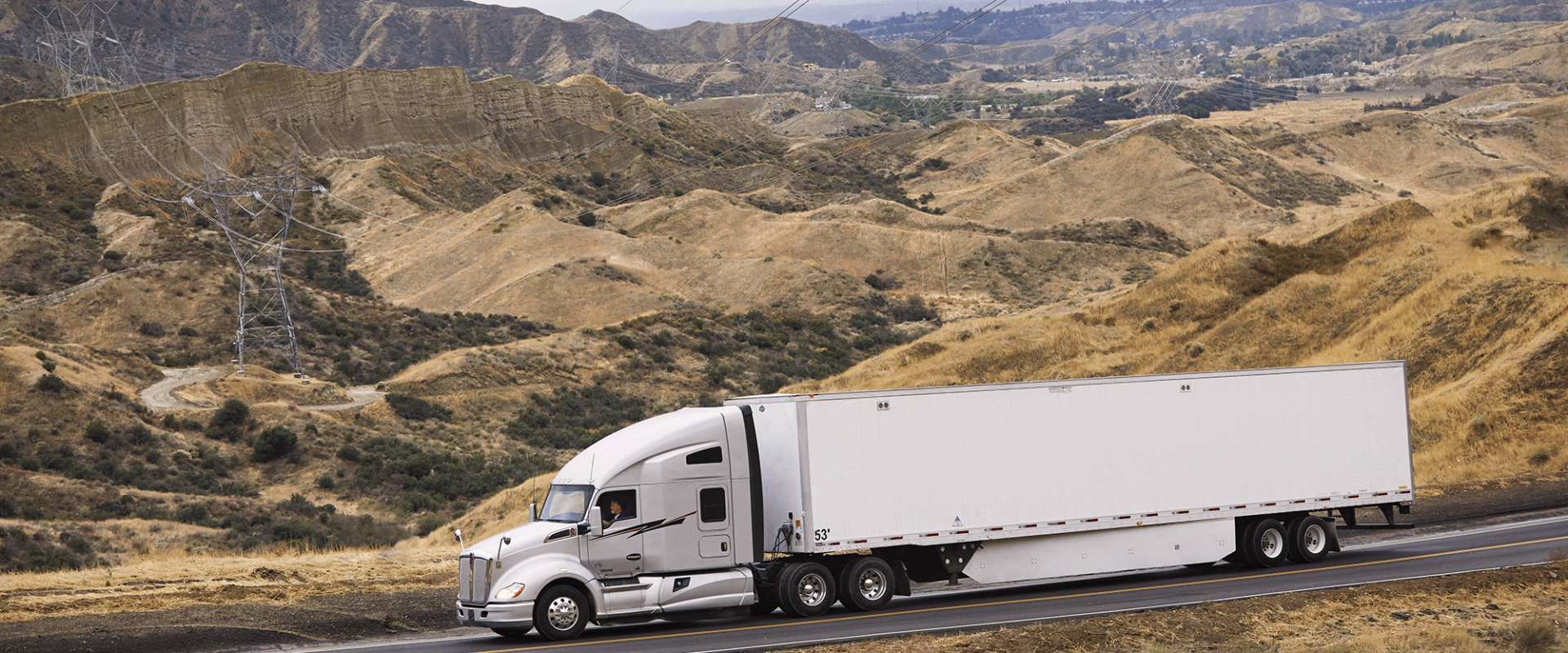 White truck driving on road