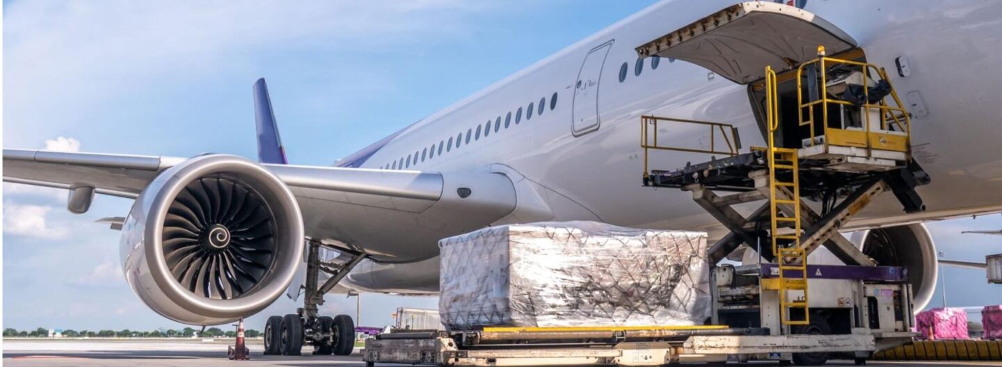 plane being loaded up with cargo