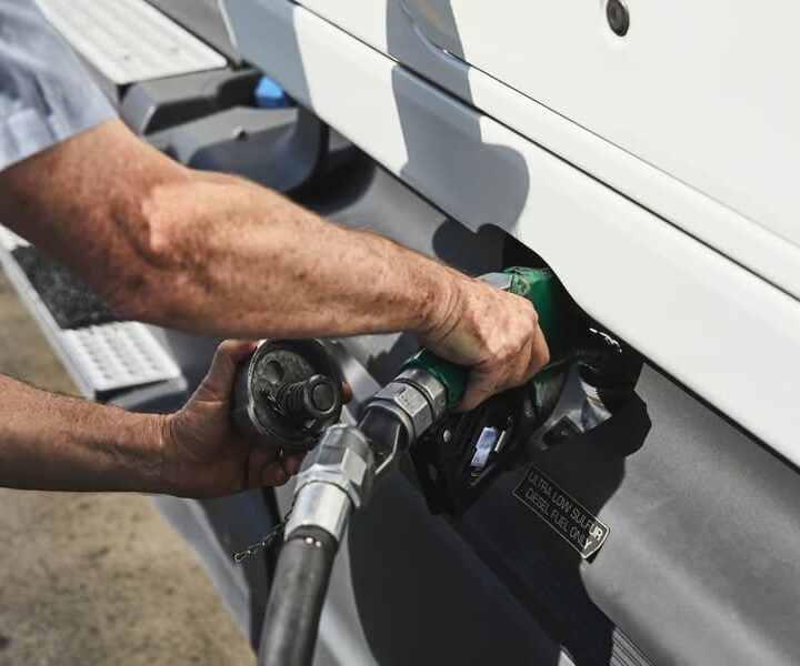 Driver fueling gas into the truck