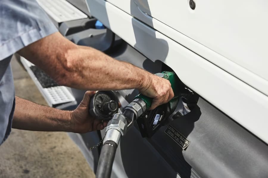 Driver fueling gas into the truck