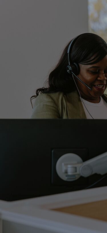 Woman with headset working in office