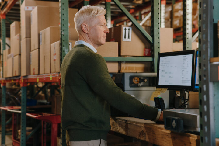 Shipper looking at data on computer screen